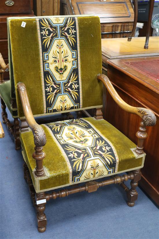 A pair of carved walnut framed armchairs